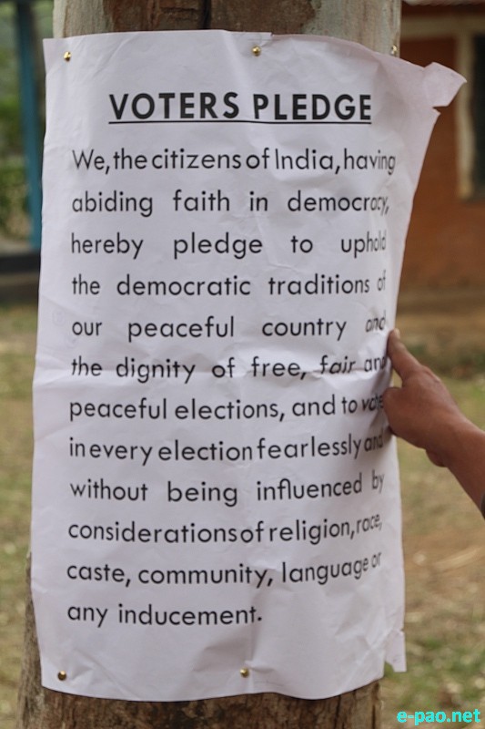 Voter Pledge - A sign posted near  a polling station at Kangpokpi on the eve of polling in Outer Manipur Parliamentary Constituency on April 09 2014  