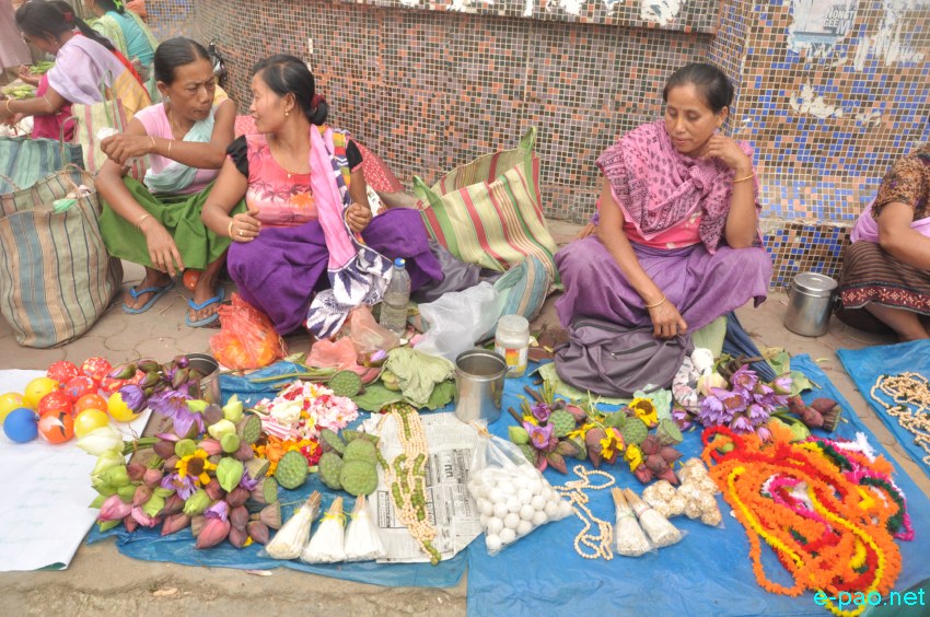 Women vendors selling items used during 'Kang Chingba'  Festival at Khwairamband Keithel, Imphal  :: June 29, 2014