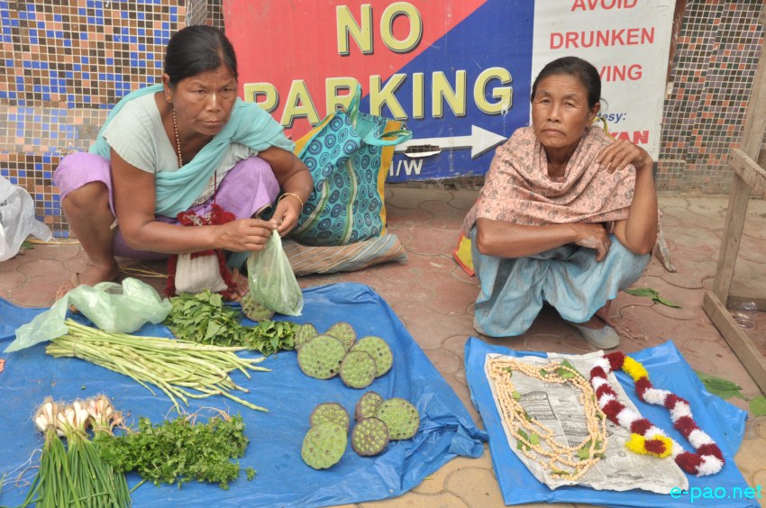 Women vendors selling items used during 'Kang Chingba'  Festival at Khwairamband Keithel, Imphal  :: June 29, 2014