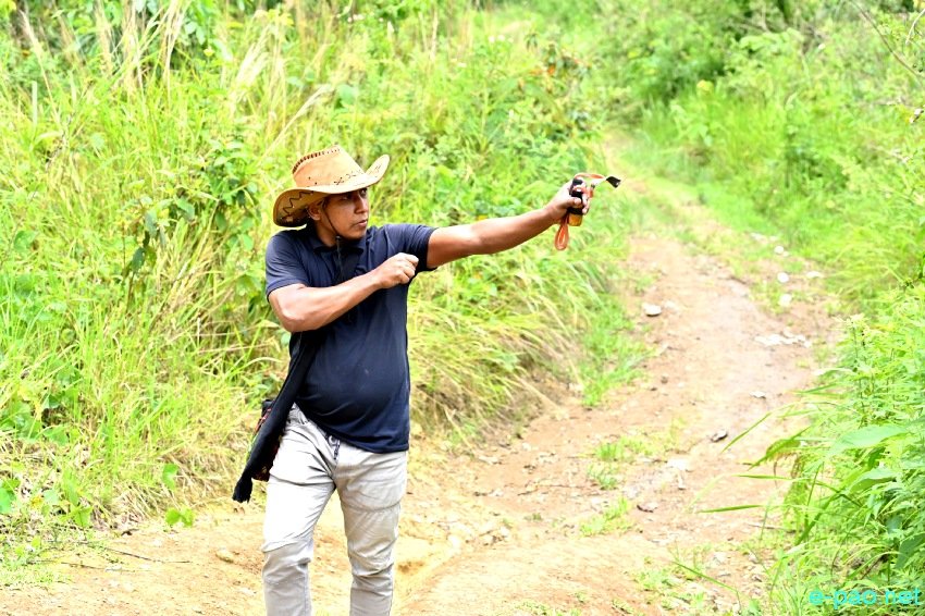 Environmental Activist peculiar way of planting seeds using a slingshot  at Kwakta ward no 7, Bishnupur ::  June 2021