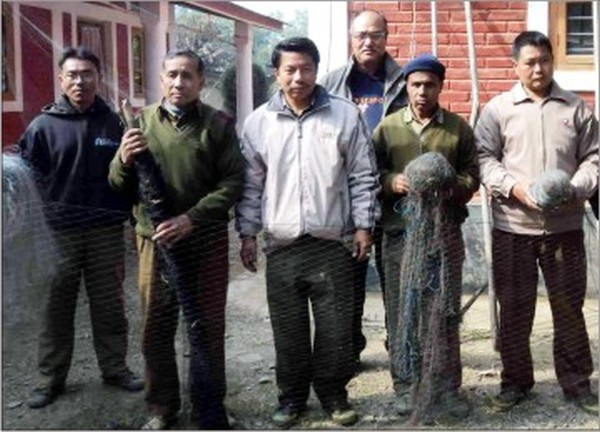 Forest officials with the nets seized from the hunters