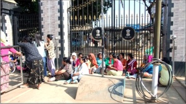 Women staging a sit-in-protest in front of Gate No 2