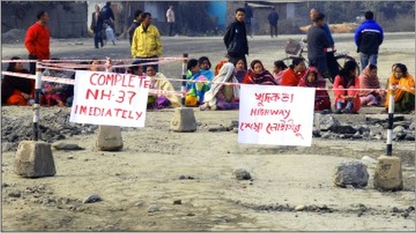 Locals blocking the road stretch along NH-37 in Imphal