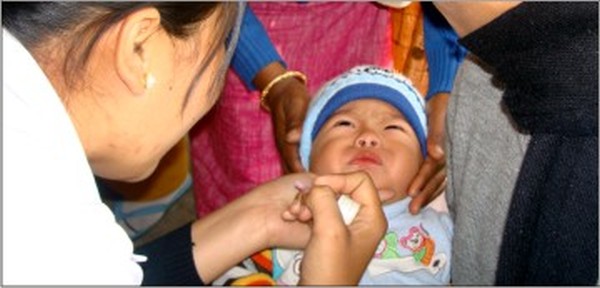 A child being administered polio drops