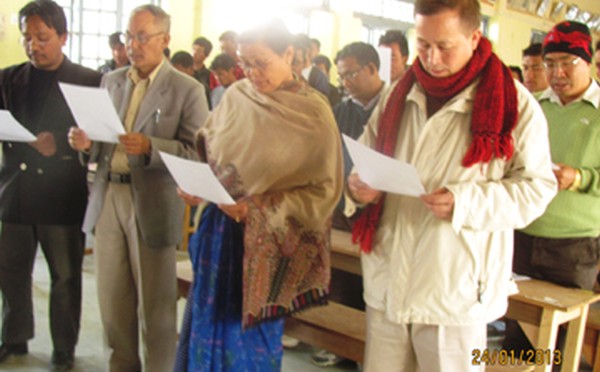 Staff and students of DMC Sc being administered oath on National Voters Day