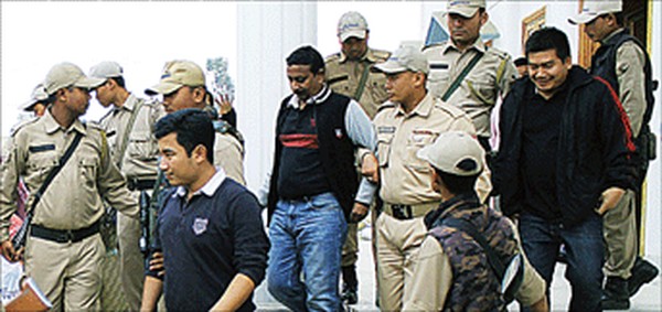 The accused being led out of the Court after the hearing