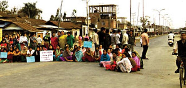 Locals blocking the road to protest the killing of a driver