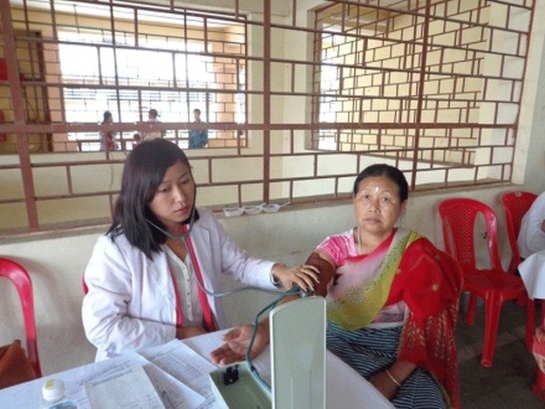 Patient being examined during a medical camp held as part of World Health Day observance