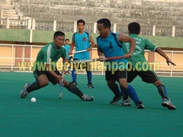 A hockey match between Manipur (blue) and Mizoram (green) during the 27th North East Games at Khuman Lampak
