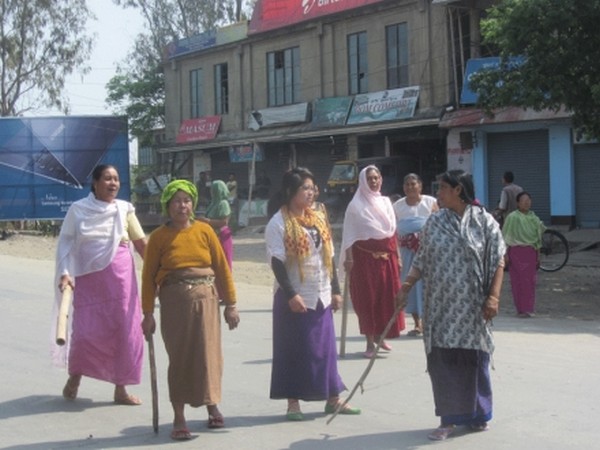 Women bandh supporters blocking road on the second day of the indefinite strike