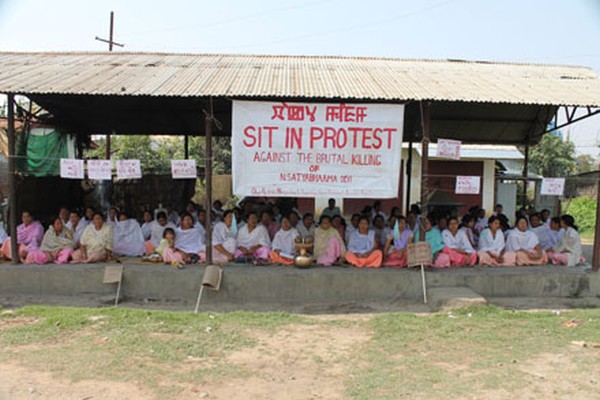 Womenfolk staging sit in protest against the ghastly murder of Ningombam Satyabhama at Nongmeibung under the aegis of Nongmeibung Development Meira Paibi Lup