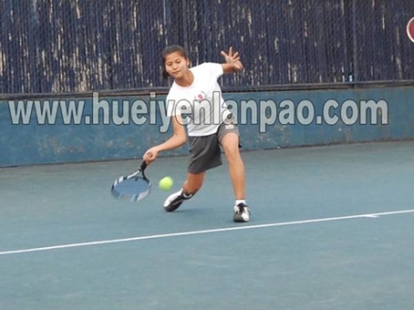 Bunty hitting a forehand shot to her opponent