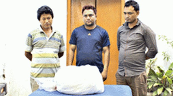 Arrested smugglers along with the drugs