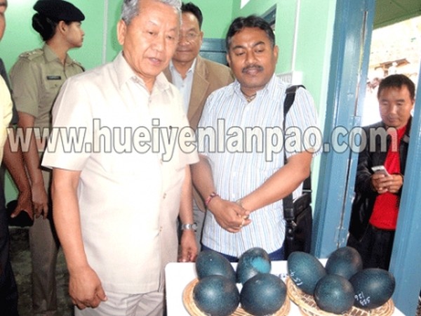 Dy CM Gaikhangam and Commerce & Industries Minister Govindas Konthoujam looking at eggs of Emu