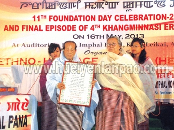 Renowned Khongjom Parva artist Nameirakpam Ibeni being honoured with Tomthin Khudol on the occasion of 11th anniv of HERICOUN