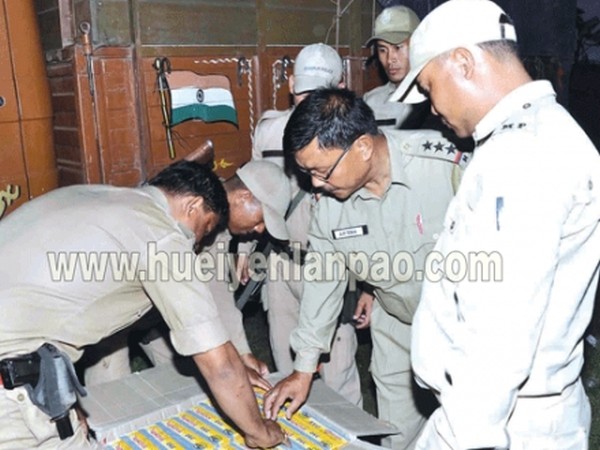 Thoubal Police personnel checking the seized Zarda cartons