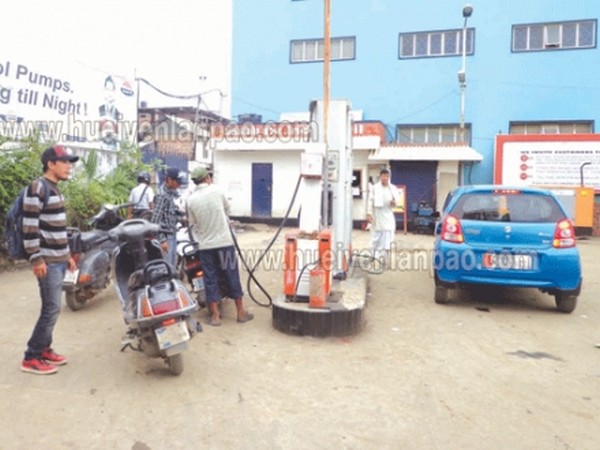 People filling up fuel from an oil pump at Imphal which opens during the CPI sponsored bandh