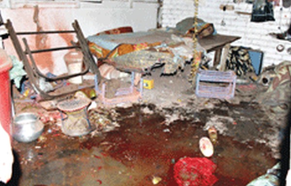 The blood spattered rented room after the blast