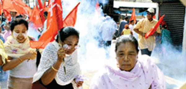CPI workers being tear gassed