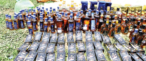 File pic of IMFL bottles seized by Government agencies concerned