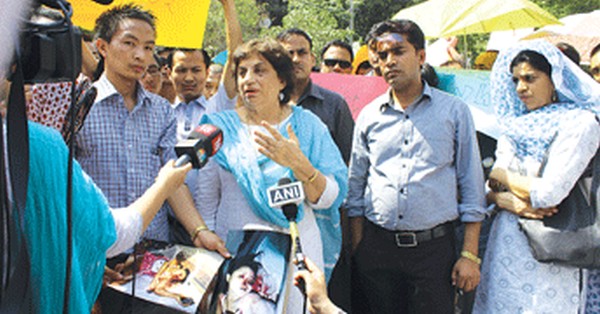 Kiran Walia meeting protestors and assuring them of all help from her side