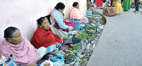 File pic of women vendors hawking their goods at the pavement