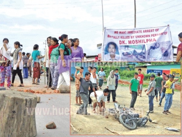 Local residents enforcing bandh along Imphal-Moreh Road at Tengnoupal on Tuesday