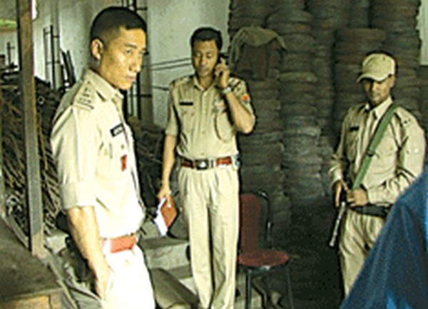 Police personnel inspecting