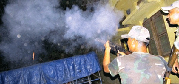 Police firing tear gas shells to disperse the mob on Sunday night at CCpur