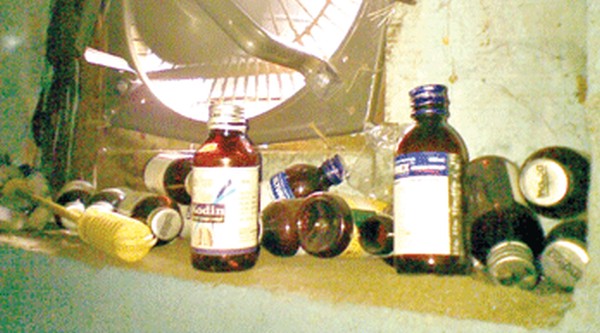 Empty bottles of codeine based cough syrup at the toilet of the Old State Secretariat