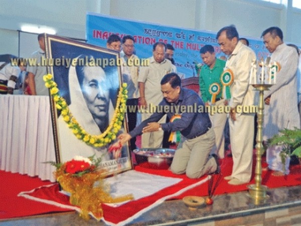 Education Minister M Okendro paying tributes to the photograph of Queen Dhanamanjuri