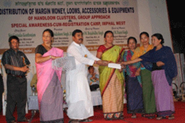 Assistance being handed over to members of 12 handloom clusters of Imphal West district