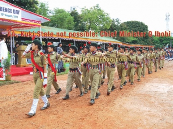 CM Ibobi receiving the salute of the march pass contingent during Independence Day celebration at Imphal