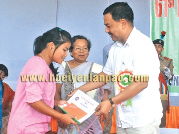Education Minister M Okendro presenting meritorious award to one of the students during the foundation day celebration of Imphal College