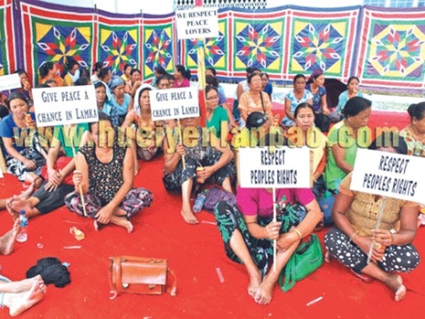 Holding placards in hands, womenfolk taking part in the sit-in