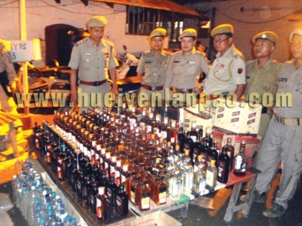 Liquors seized by City Police from different parts on Imphal being displayed to media 