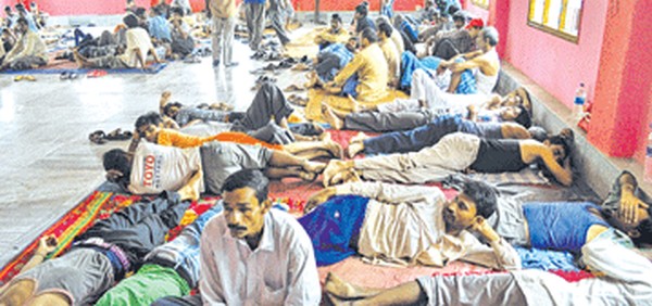 Migrant workers at the relief camp at Dharmashala