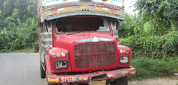 A damaged Tata truck on the highway