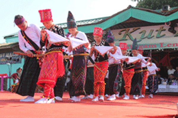 Troupe from Myanmar presenting cutural item during Kut celebration at Galngam Lentol, Moreh