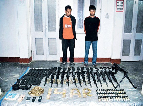 Arms and ammunitions recovered by Assam Rifles from Mizoram along with the arrested persons