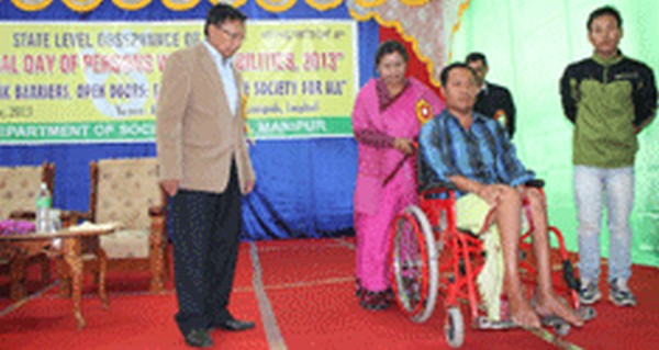 A wheelchair being donated at observance function of International Day for Persons With Disabilities