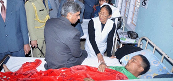 Governor VK Duggal gives his personal attention to a patient