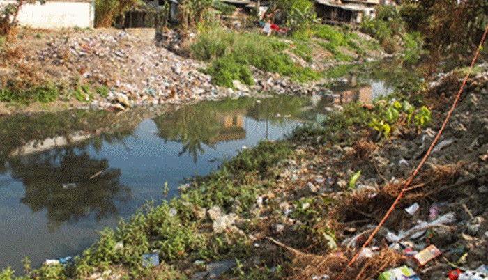 waste materials and garbage being disposed into Nambul river