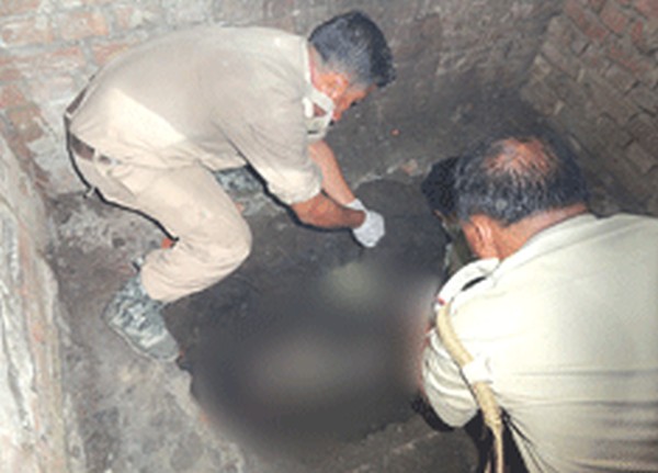 Police investigators search for buried corpses at a URF camp