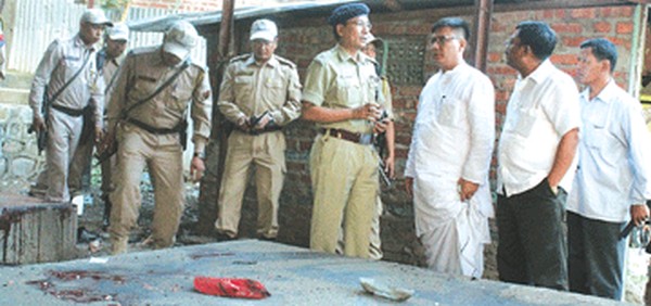 PHE Minister I Hemochandra and police personnel inspecting site of the bomb blast