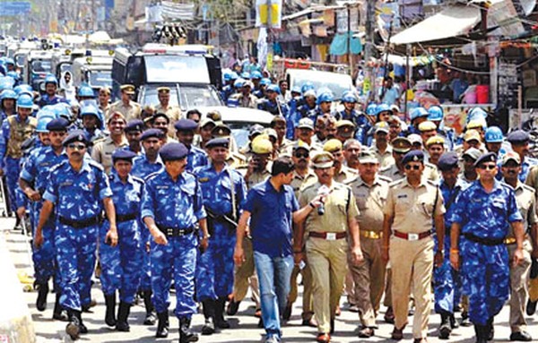 Securitymen conduct flag march ahead of LS polling in Varanasi