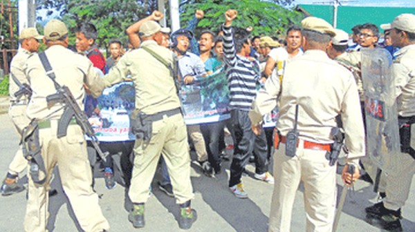 A team of police personnel are trying to block the agitating students who are demanding for implementation of Inner Line Permit System in Manipur on Friday evening at Imphal
