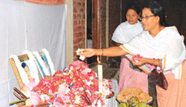 People paying floral tributes