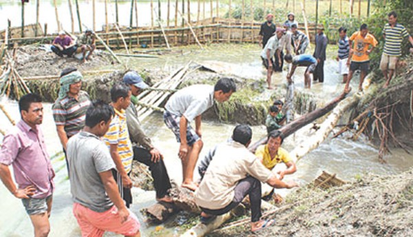 People constructing dykes over a breached river bank