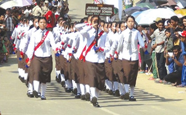 Students stage a march past during the 118th birth anniversary of Irabot observation at Jiribam